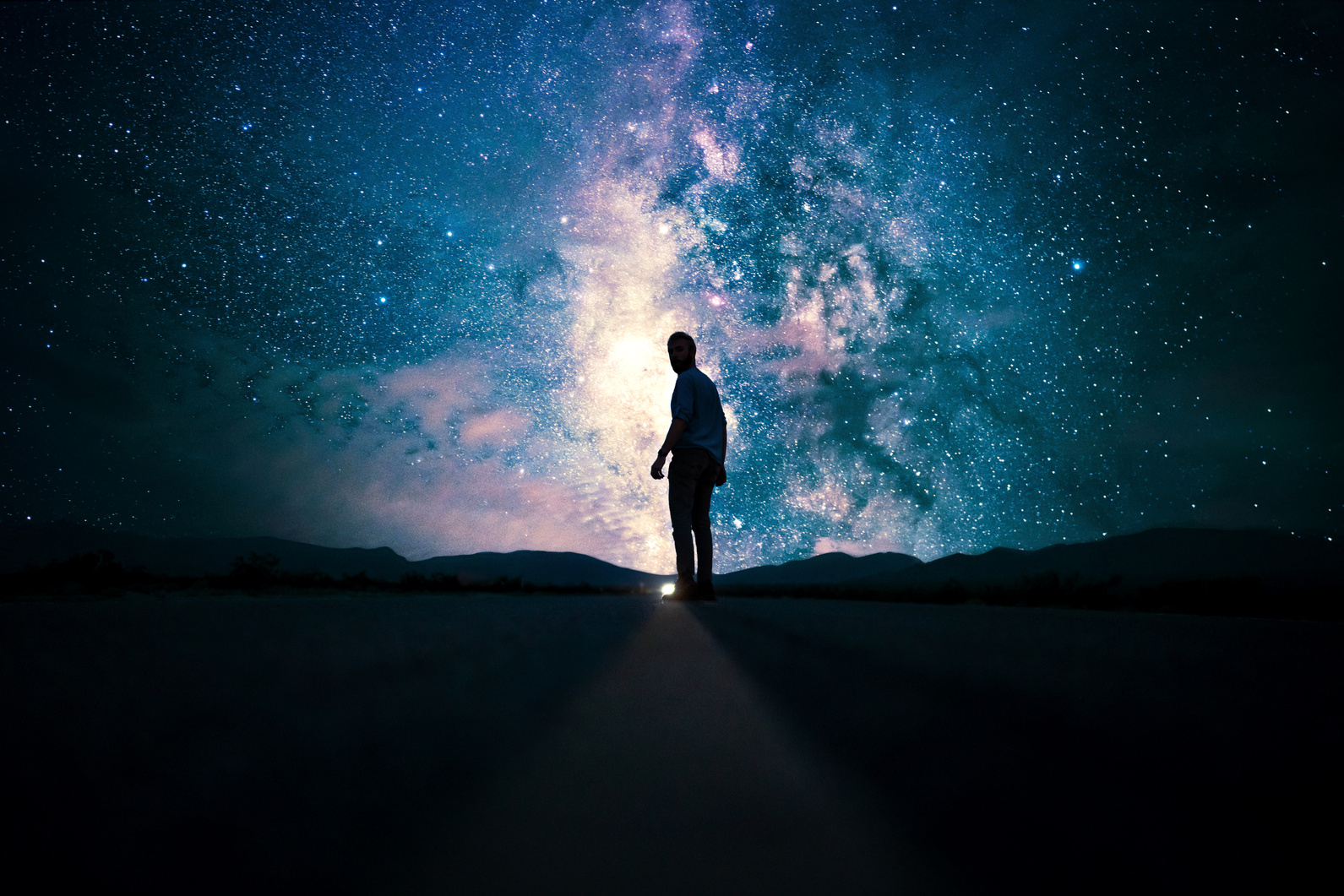 A Man Walking on Empty Road
